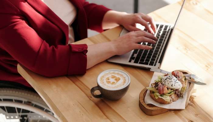 Woman Eating Lunch At Work