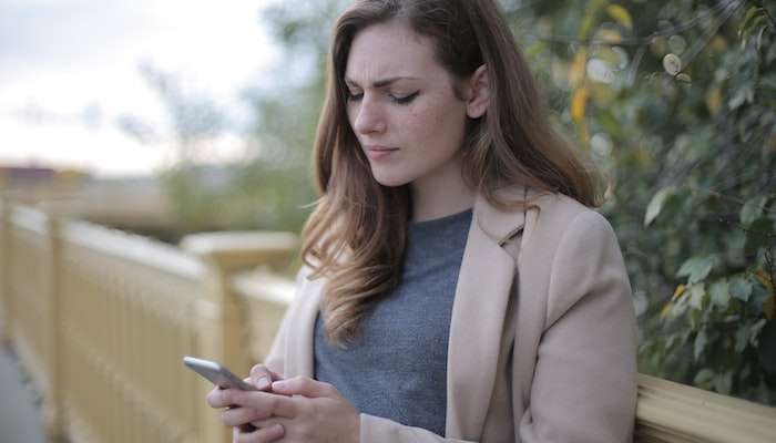 Social Gathering Glued To Phone