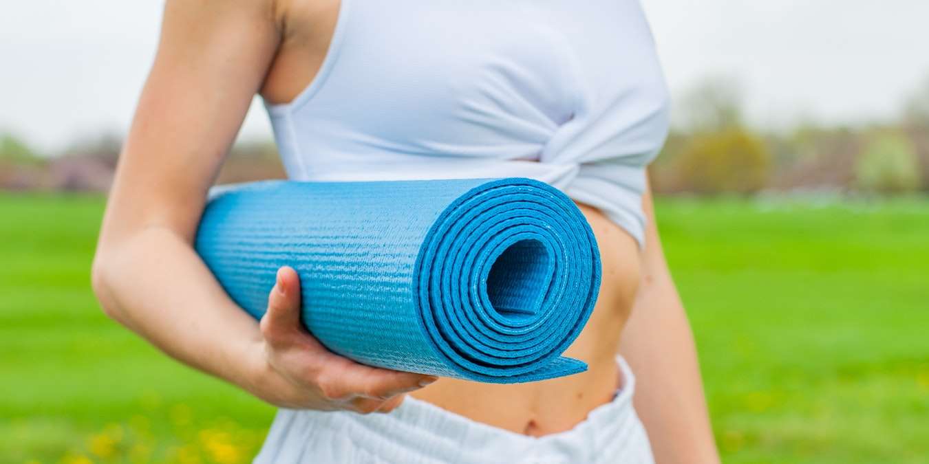 Woman Holding Best Yoga Mat