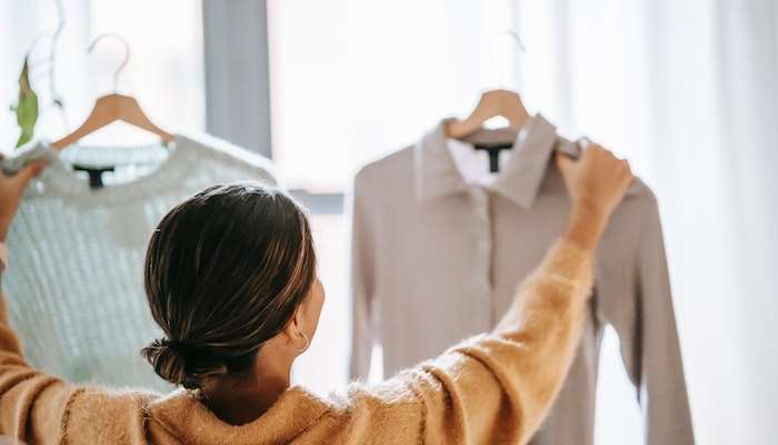 Woman With Decision Fatigue After Making Clothing Choices