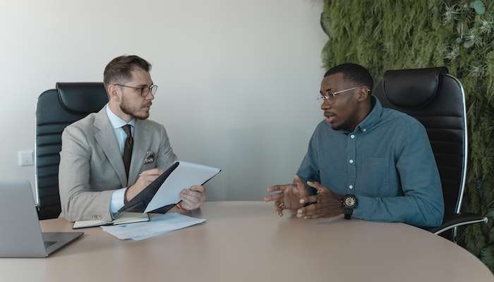Two Men Working Through Job Interview Questions