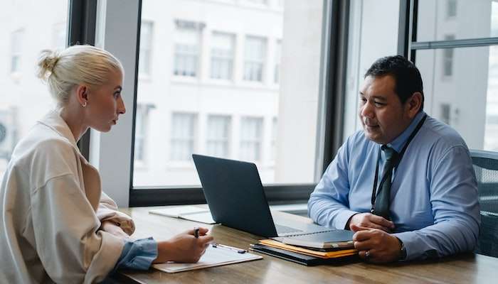 Man Reading Questions To Ask In A Job Interview 